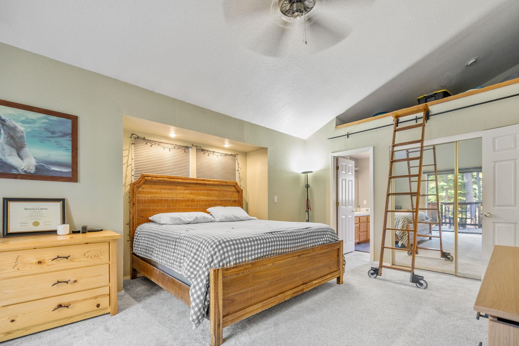 50689 Conifer Drive Soda Springs, CA 95728 - Photo 8 of 28 a bedroom with a bed and wooden floor
