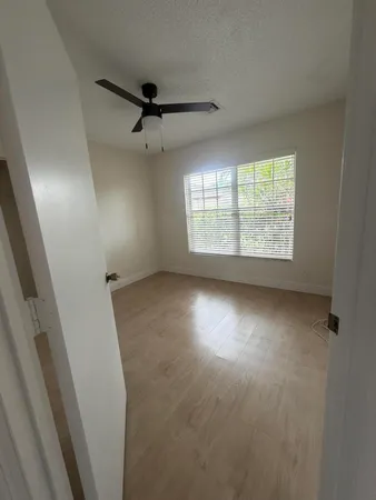 a bathroom with a toilet a sink and a mirror