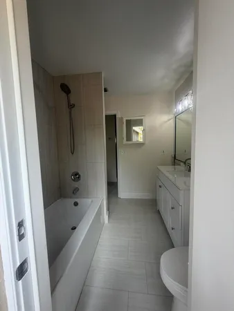 a bathroom with a sink and mirror