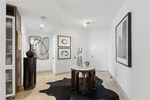 a view of a hallway with seating area