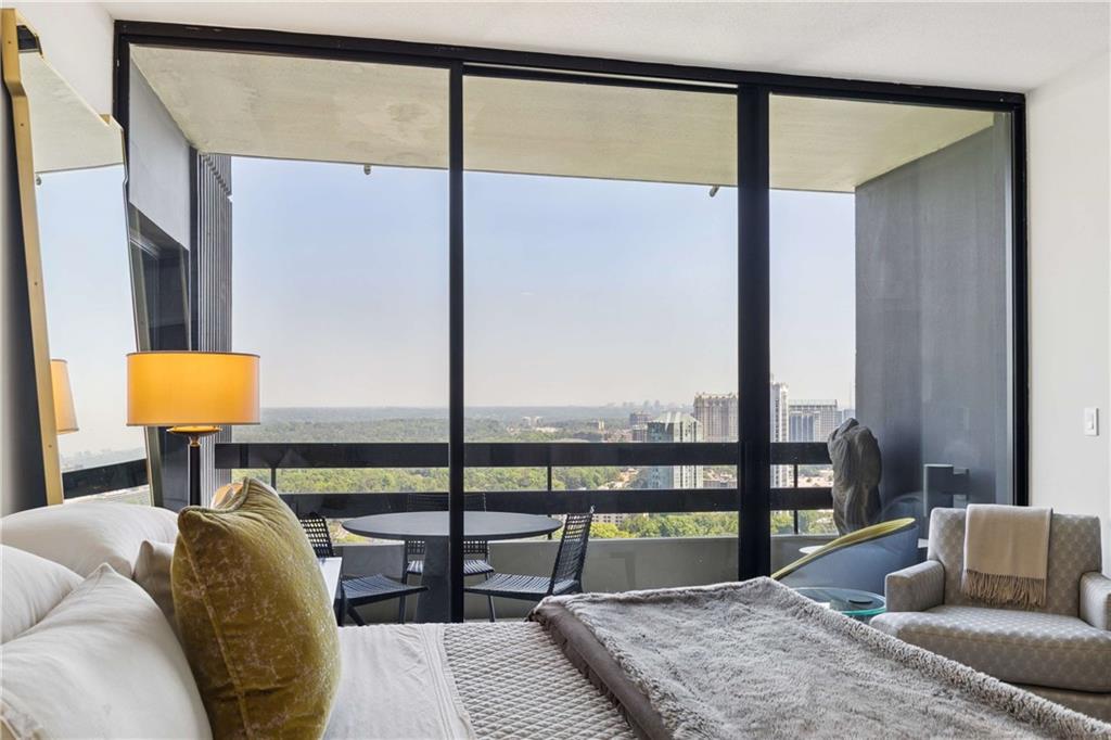 2660 Peachtree Road Northwest, Unit 39D Atlanta, GA 30305 - Photo 23 of 45 a bedroom with furniture and a window