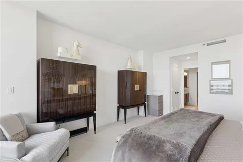 a bedroom with furniture and a window