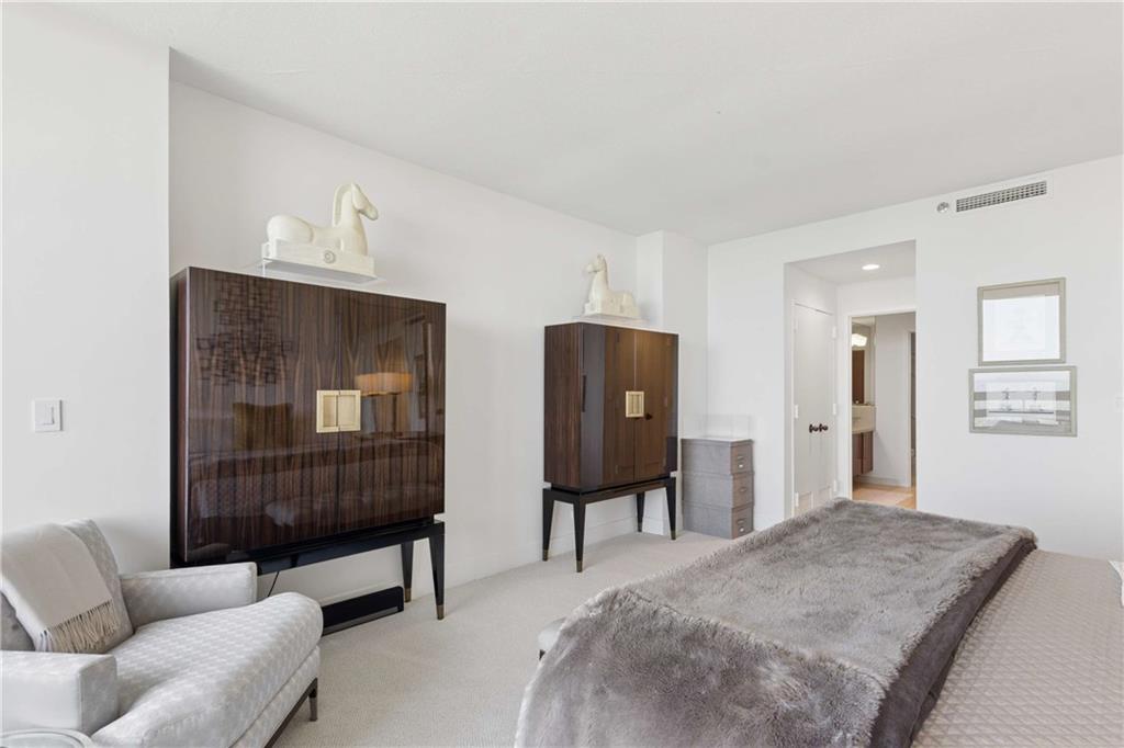 2660 Peachtree Road Northwest, Unit 39D Atlanta, GA 30305 - Photo 24 of 45 a bedroom with furniture and a window