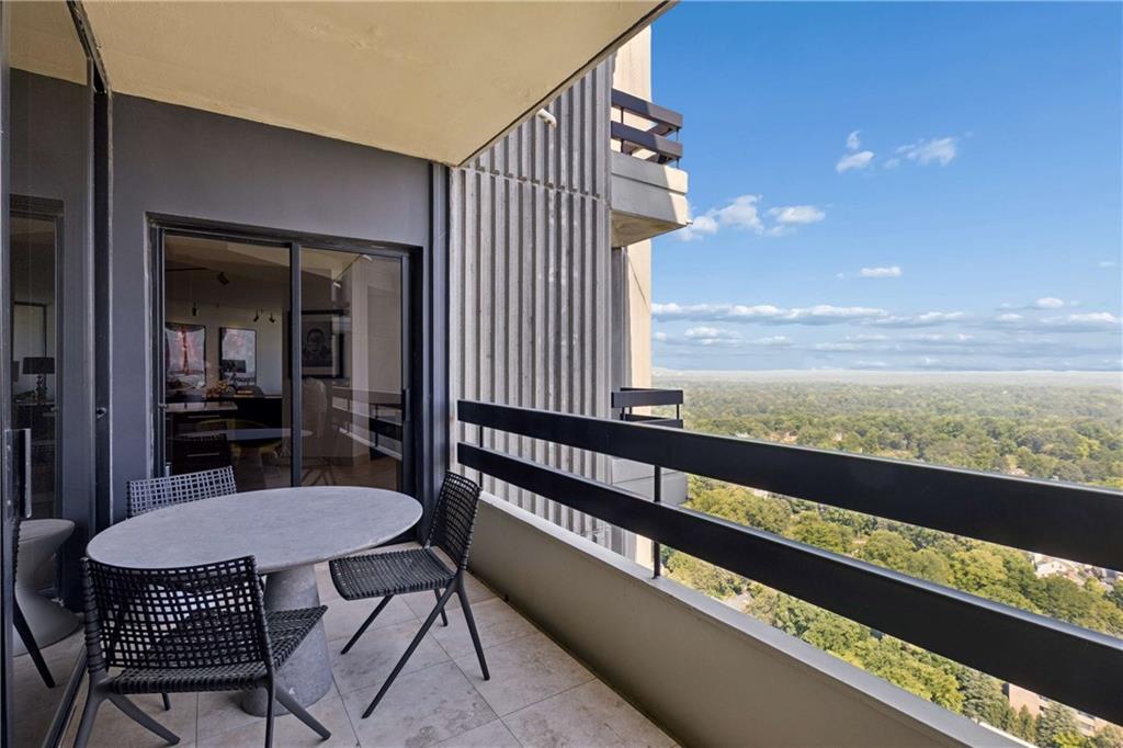 2660 Peachtree Road Northwest, Unit 39D Atlanta, GA 30305 - Photo 26 of 45 a view of a balcony with chairs