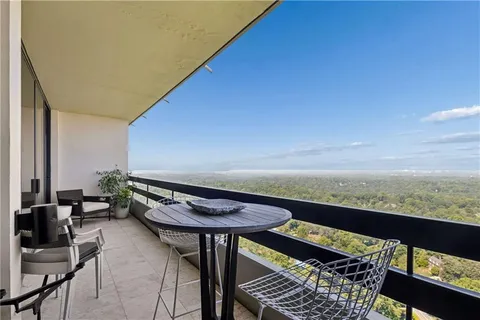 a view of a balcony with chairs