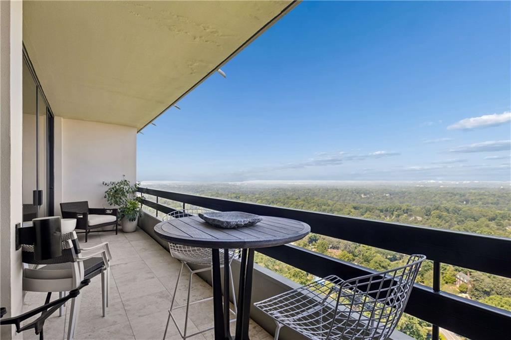 2660 Peachtree Road Northwest, Unit 39D Atlanta, GA 30305 - Photo 32 of 45 a view of a balcony with chairs