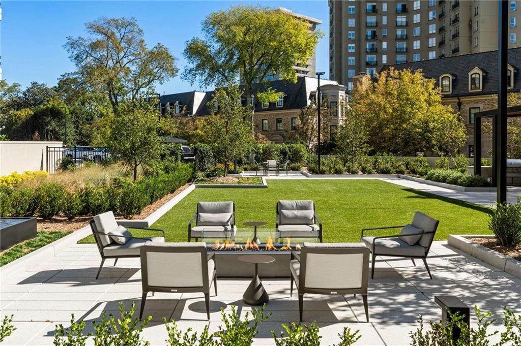 2660 Peachtree Road Northwest, Unit 39D Atlanta, GA 30305 - Photo 44 of 45 a view of chairs and table on the patio