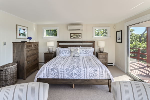 217 Barnes Road Oak Bluffs, MA 02557 - Photo 12 of 60 The primary bedroom is spacious and offers water views , an en-suite bath, and private deck.