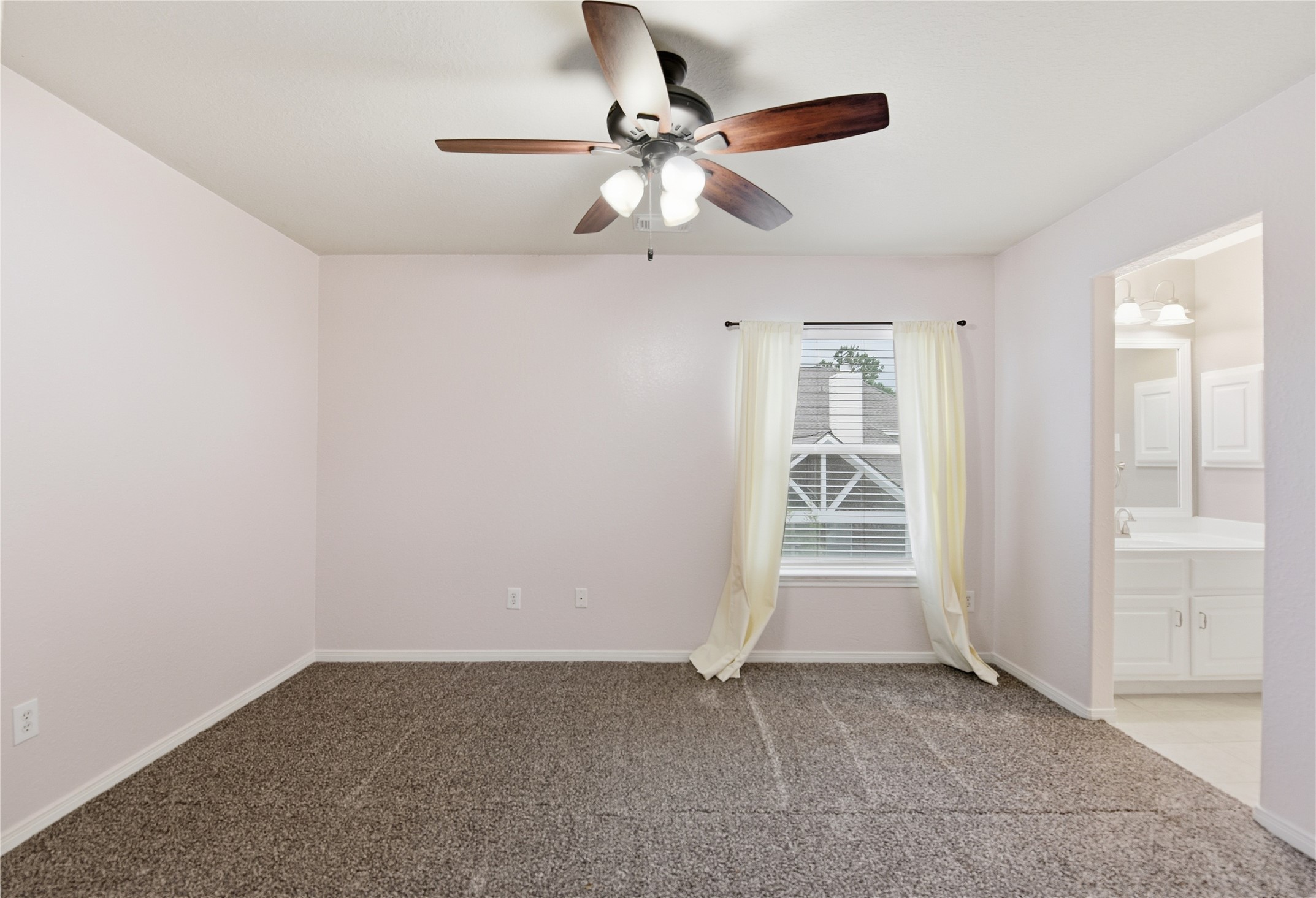 3130 Red Maple Drive Friendswood, TX 77546 - Photo 19 of 26 an empty room with closet and a chandelier fan