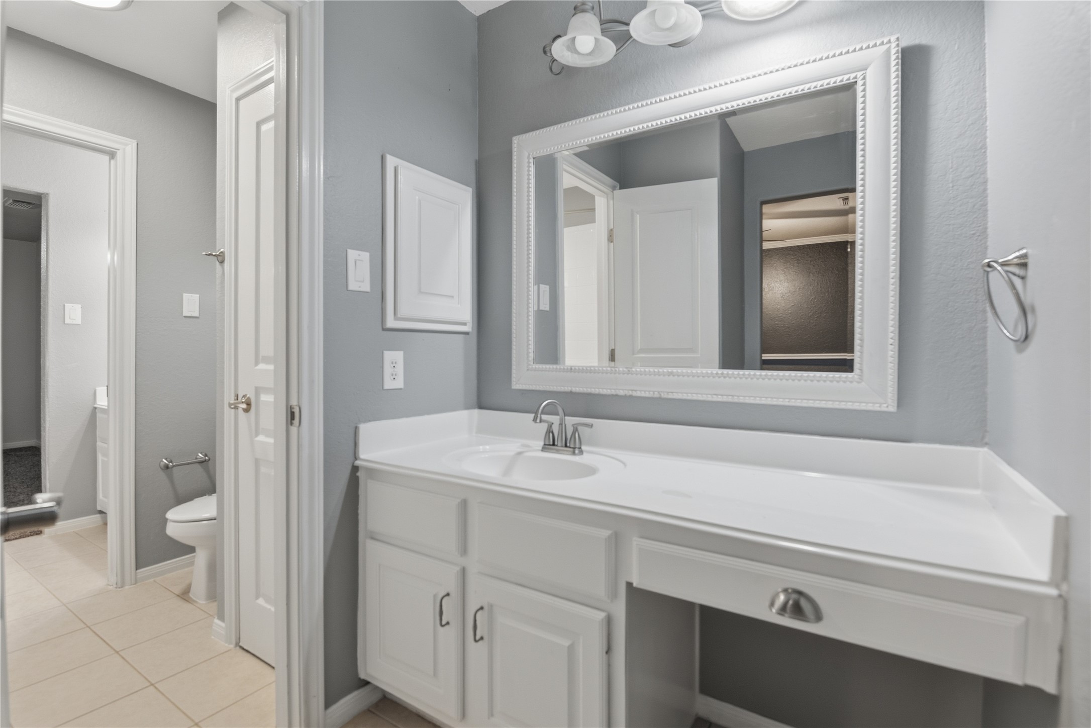 3130 Red Maple Drive Friendswood, TX 77546 - Photo 23 of 26 a bathroom with a sink and a mirror