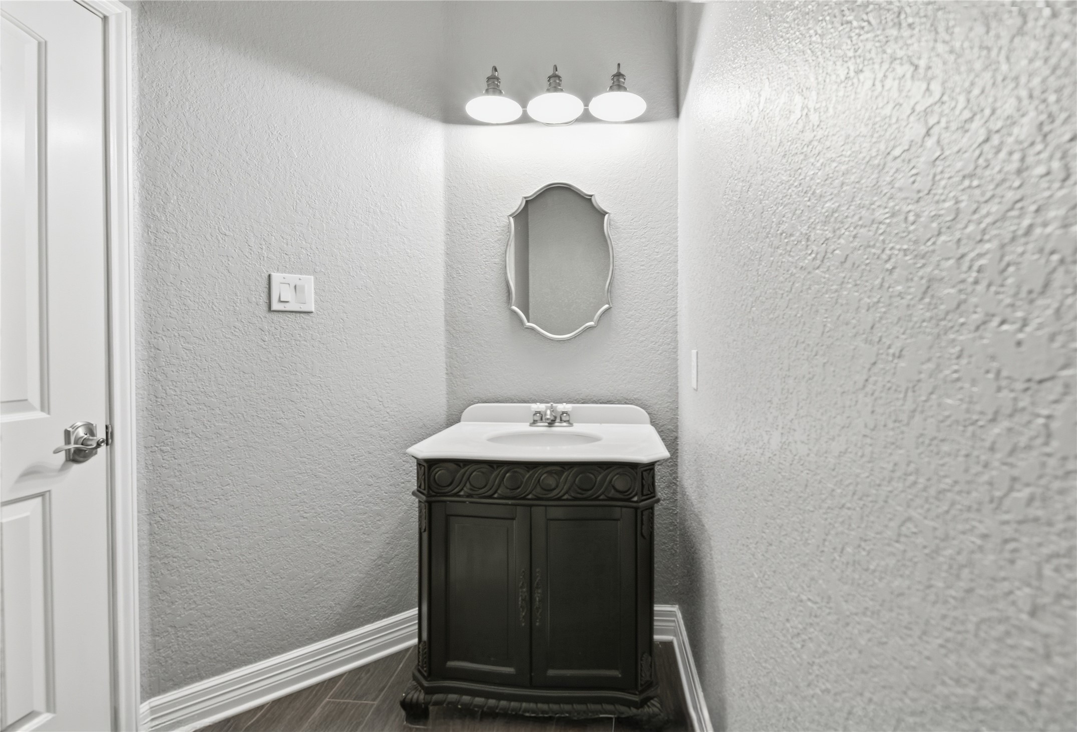3130 Red Maple Drive Friendswood, TX 77546 - Photo 24 of 26 a bathroom with a sink and a mirror