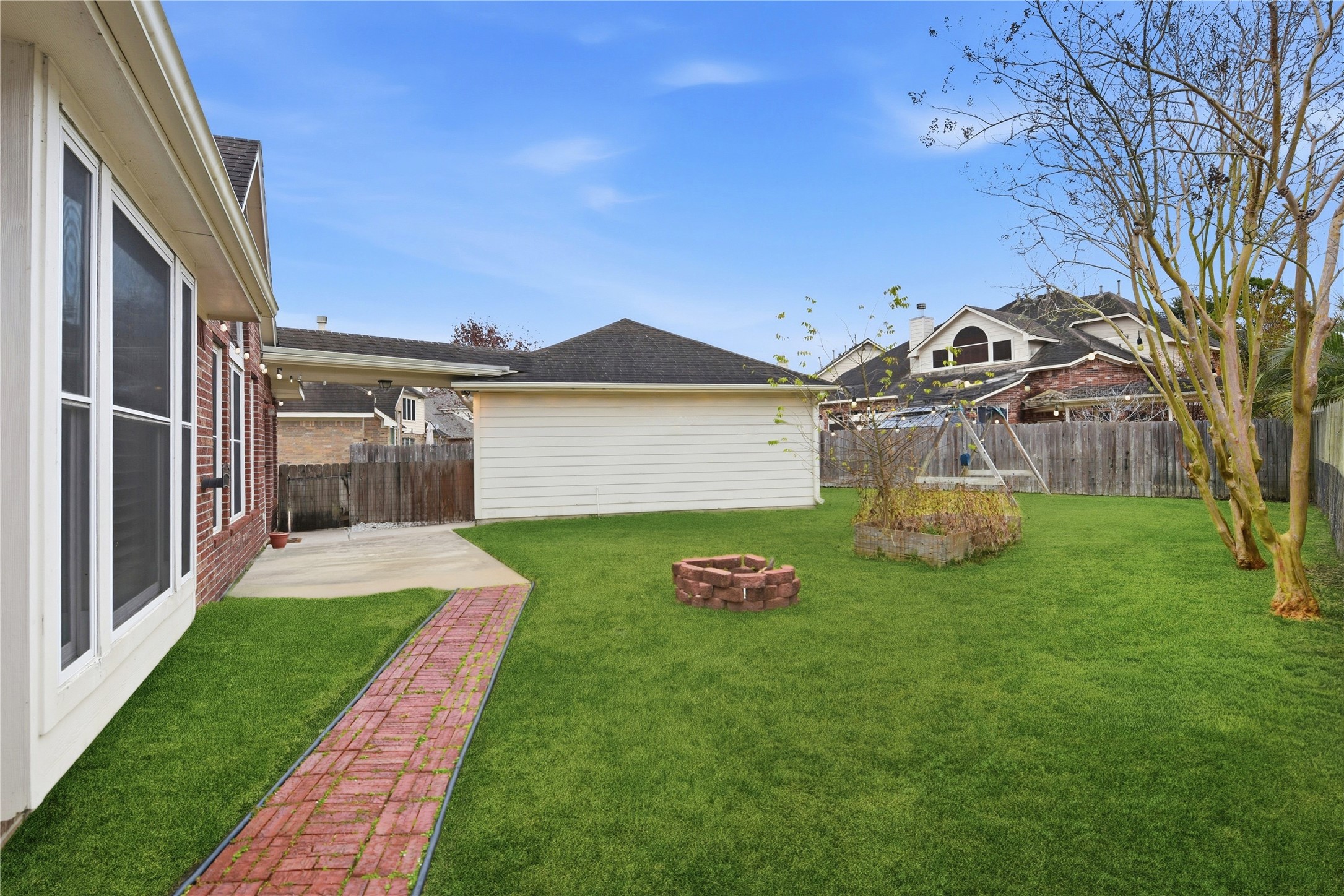 3130 Red Maple Drive Friendswood, TX 77546 - Photo 26 of 26 a front view of a house with a garden
