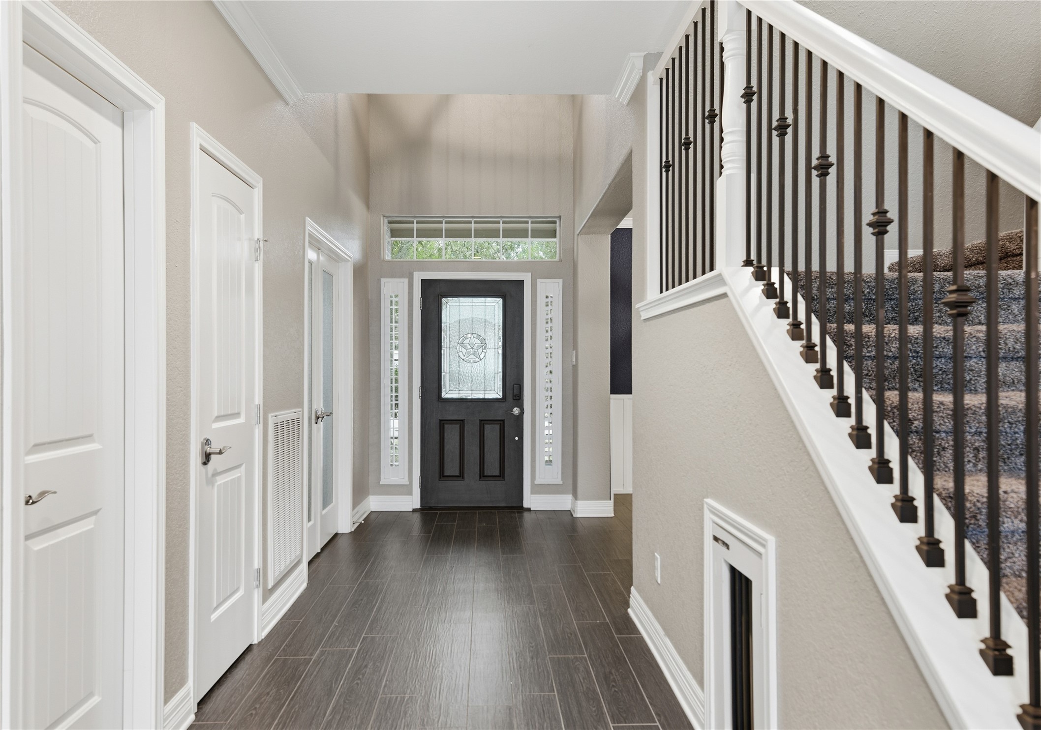 3130 Red Maple Drive Friendswood, TX 77546 - Photo 3 of 26 a view of a hallway with wooden floor and staircase
