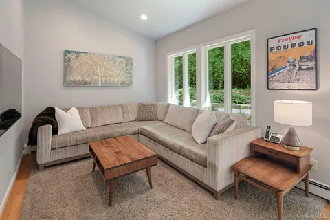 a view of a dining room with furniture wooden floor and chandelier