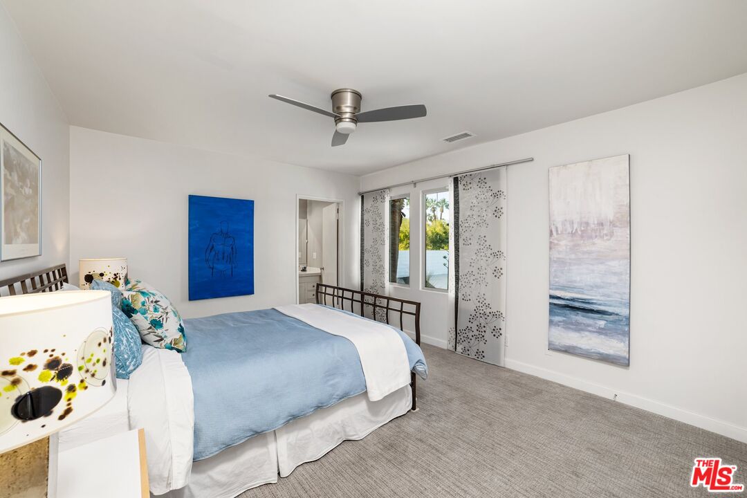 975 East Sunny Dunes Road Palm Springs, CA 92264 - Photo 19 of 40 a bedroom with a bed and a window