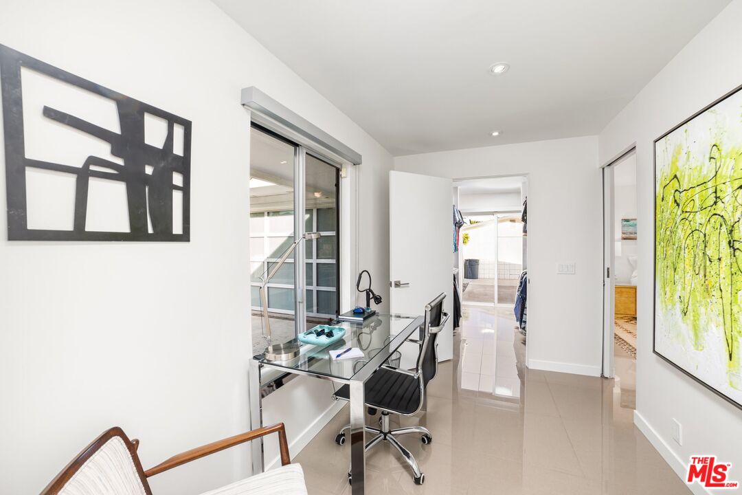 975 East Sunny Dunes Road Palm Springs, CA 92264 - Photo 23 of 40 a view of a workspace with furniture and a window