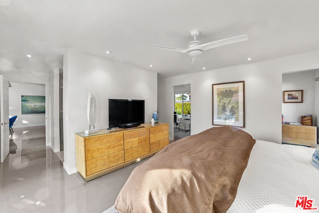 975 East Sunny Dunes Road Palm Springs, CA 92264 - Photo 24 of 40 a living room with furniture and a flat screen tv
