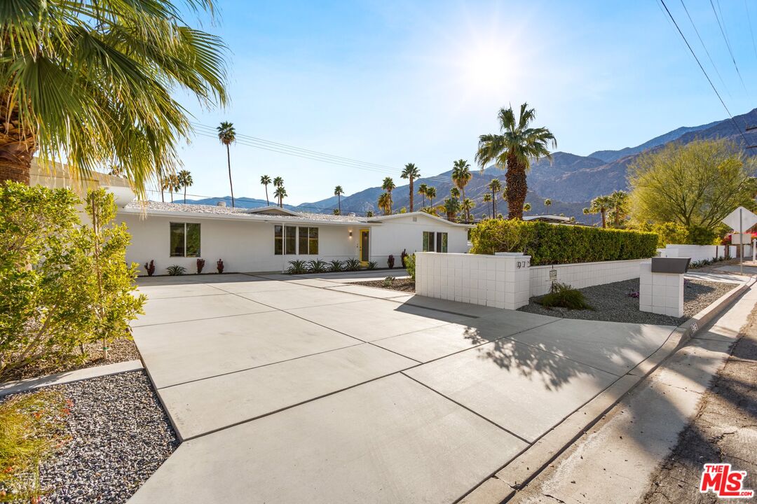 975 East Sunny Dunes Road Palm Springs, CA 92264 - Photo 3 of 40 a front view of a house with a garden