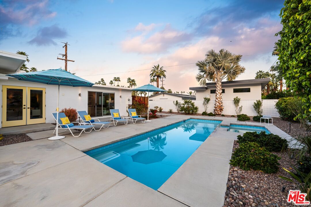975 East Sunny Dunes Road Palm Springs, CA 92264 - Photo 31 of 40 a view of a house with swimming pool and sitting area
