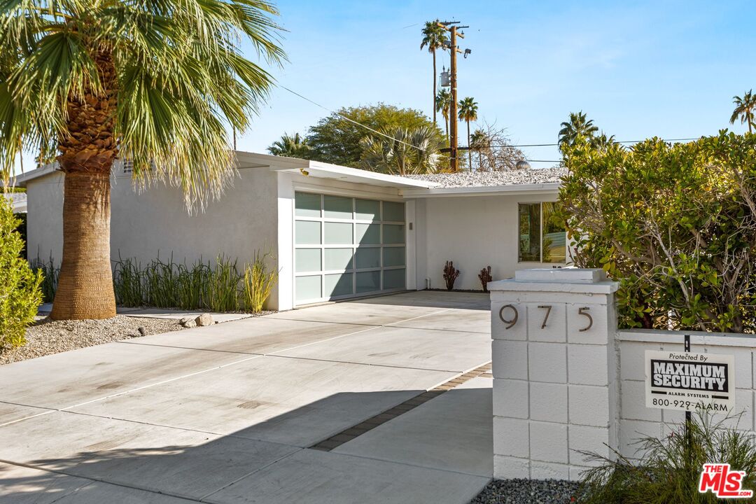 975 East Sunny Dunes Road Palm Springs, CA 92264 - Photo 4 of 40 a front view of a house with garden