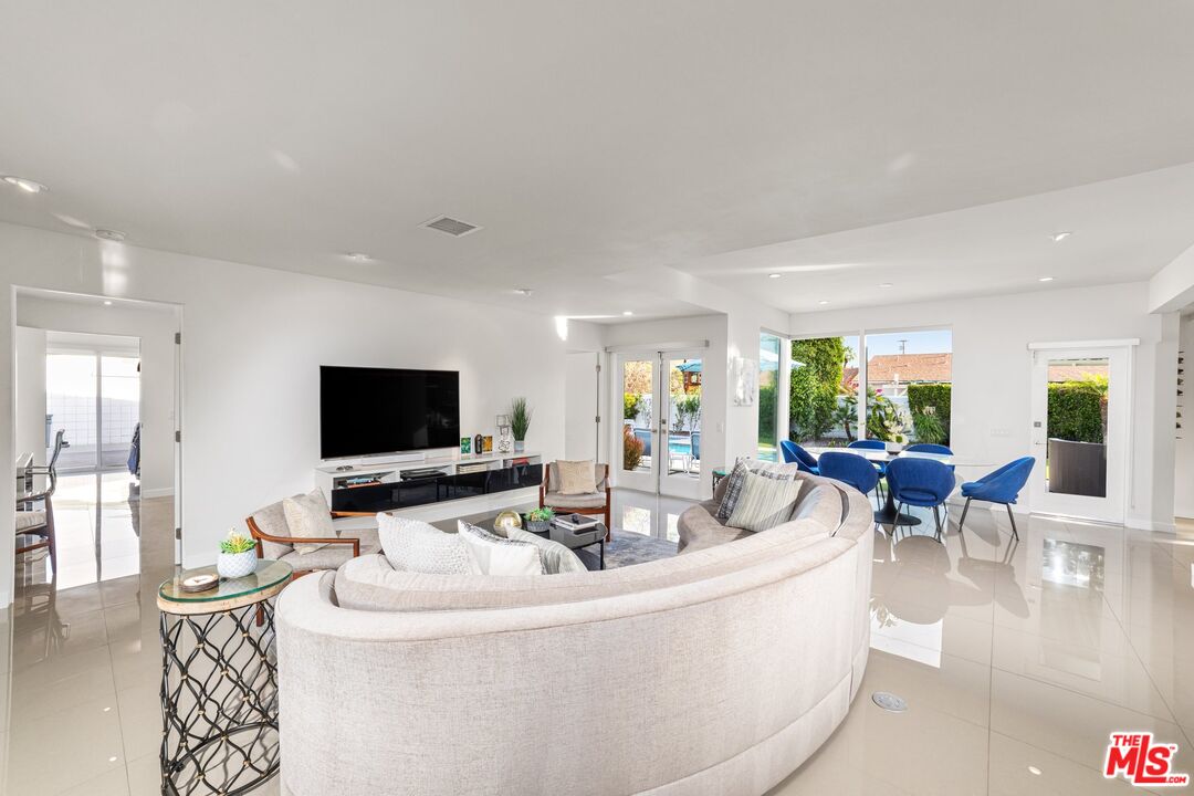975 East Sunny Dunes Road Palm Springs, CA 92264 - Photo 7 of 40 a living room with furniture and a flat screen tv
