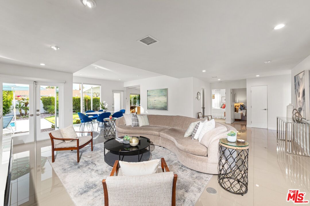 975 East Sunny Dunes Road Palm Springs, CA 92264 - Photo 10 of 40 a living room with furniture and a table