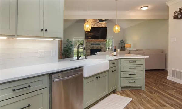 a bathroom with a sink vanity and a mirror