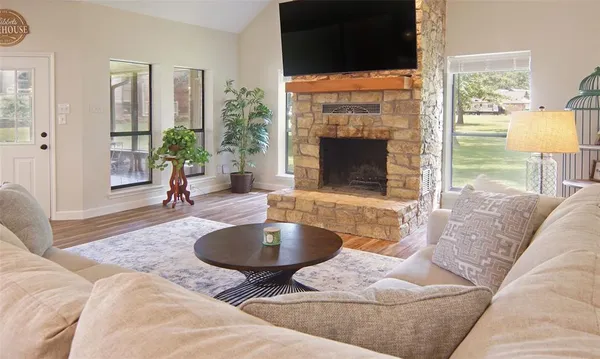 a living room with furniture and a fireplace