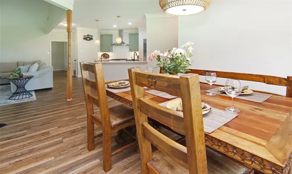 a view of a dining room with furniture and wooden floor