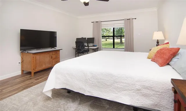 a bedroom with a bed and a television in it