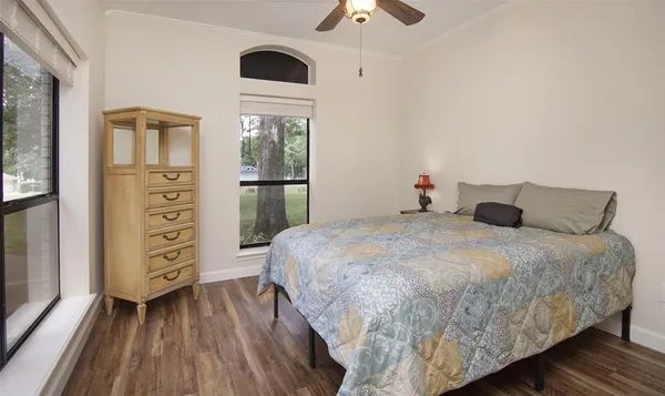 a bedroom with a bed and a dresser