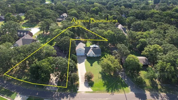an aerial view of houses with yard