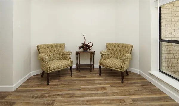 a living room with furniture and a rug