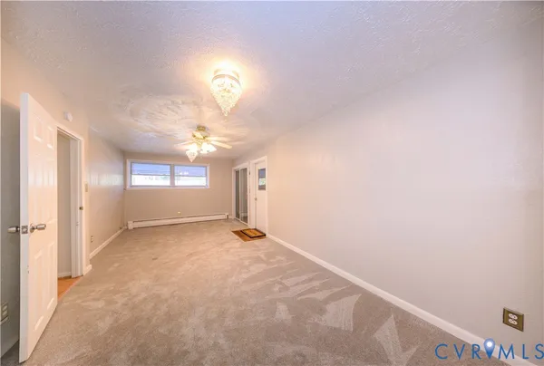 a view of an empty room with a window
