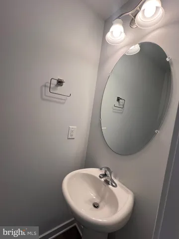 a bathroom with a sink and mirror