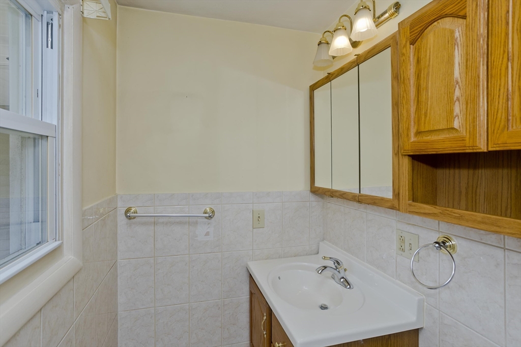 151 Bemis Road Holyoke, MA 01040 - Photo 25 of 42 a bathroom with a sink a mirror and a shower