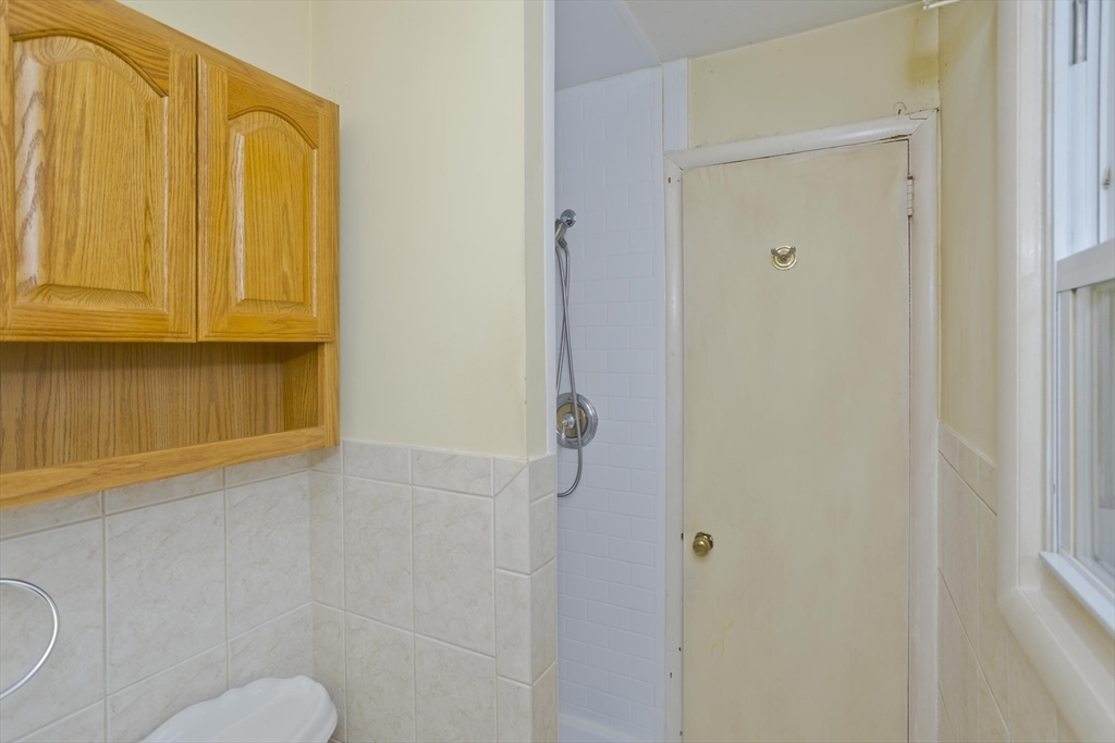 151 Bemis Road Holyoke, MA 01040 - Photo 26 of 42 a bathroom with a granite countertop sink and a mirror