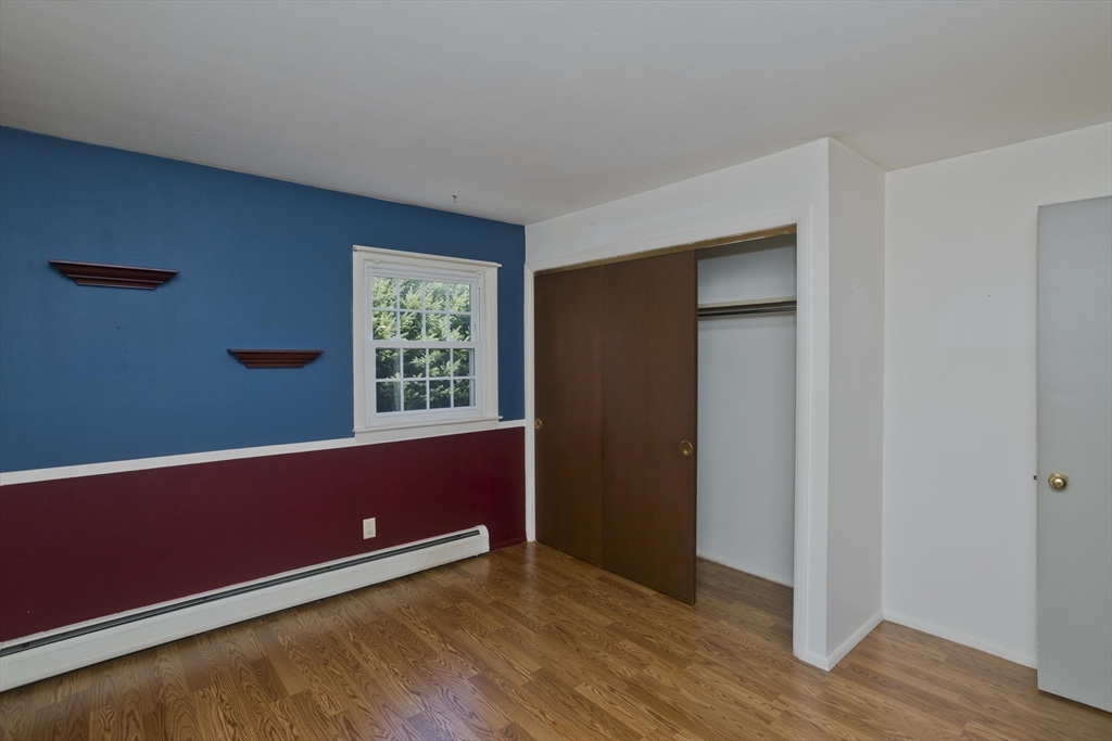 151 Bemis Road Holyoke, MA 01040 - Photo 29 of 42 a view of room with window and wooden floor