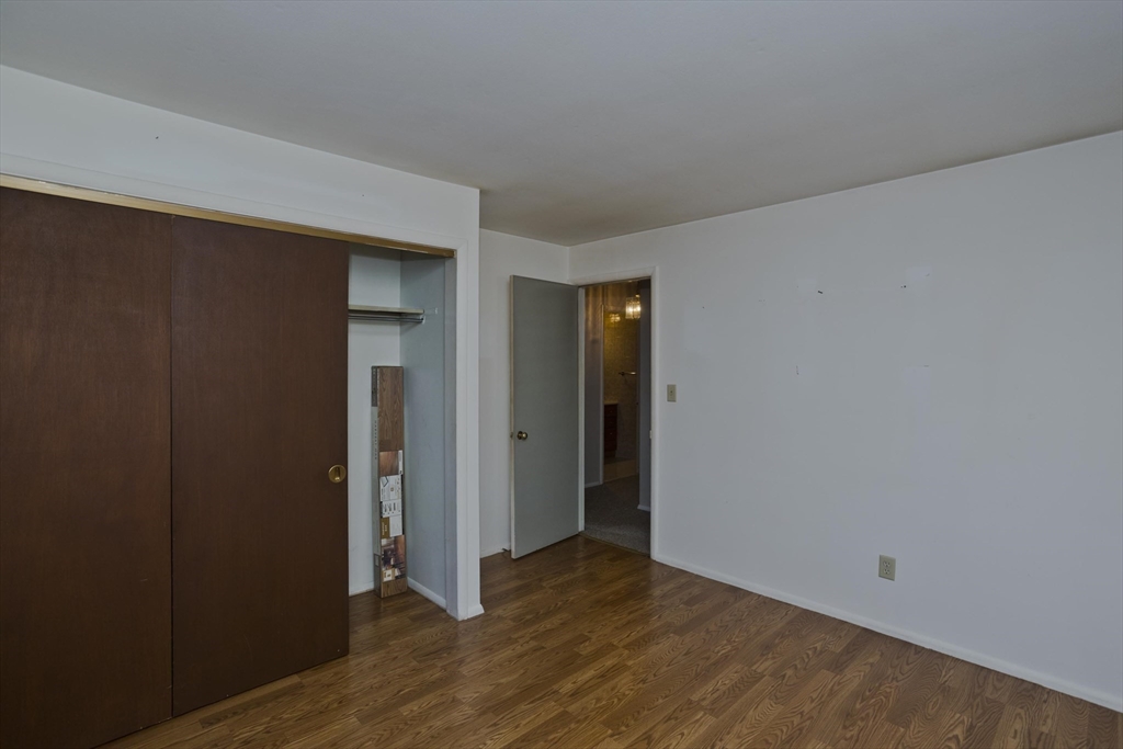 151 Bemis Road Holyoke, MA 01040 - Photo 30 of 42 a view of an empty room with wooden floor and closet