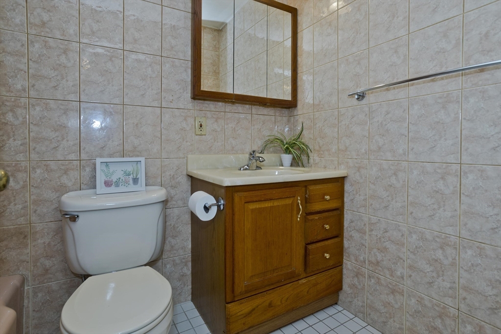 151 Bemis Road Holyoke, MA 01040 - Photo 31 of 42 a bathroom with a toilet sink and mirror