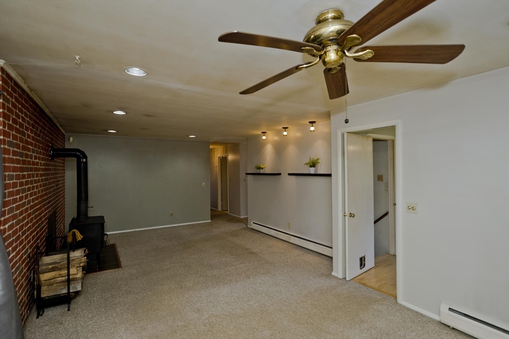 151 Bemis Road Holyoke, MA 01040 - Photo 7 of 42 a view of a hallway with a projector and furniture