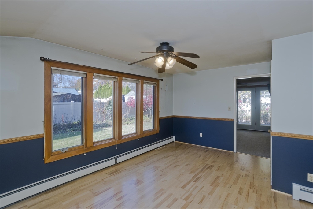 151 Bemis Road Holyoke, MA 01040 - Photo 10 of 42 a view of an empty room with window and wooden floor
