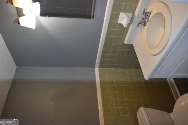 a bathroom with a sink and mirror