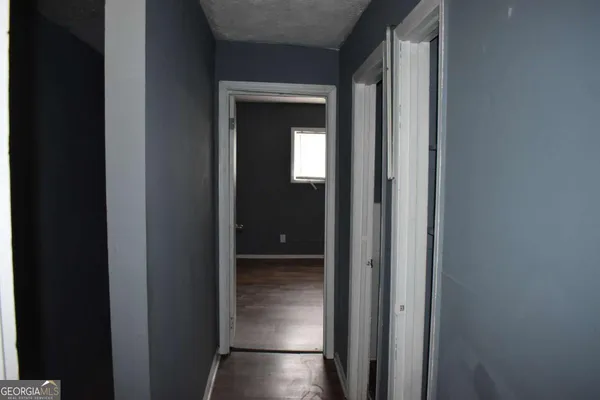 a view of a elevator and a hallway