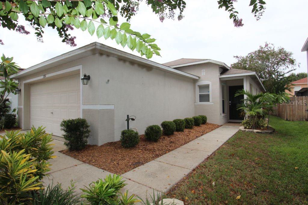 11814 Prickly Pear Way Seffner, FL 33584 - Photo 1 of 1 a house view with a garden space