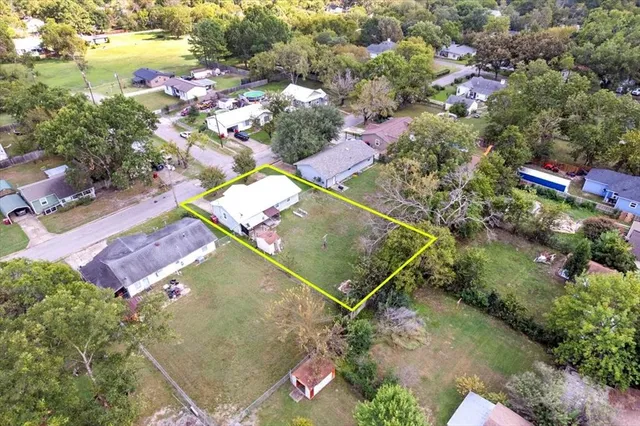 an aerial view of residential house with outdoor space and swimming pool