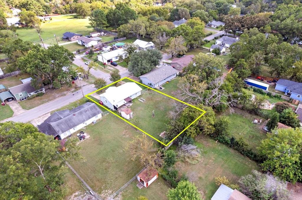 1309 Pine Street Bonham, TX 75418 - Photo 29 of 33 an aerial view of residential house with outdoor space and swimming pool