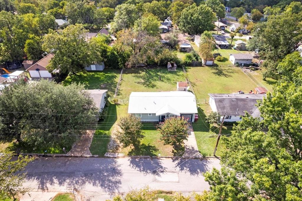 1309 Pine Street Bonham, TX 75418 - Photo 32 of 33 an aerial view of residential houses with outdoor space