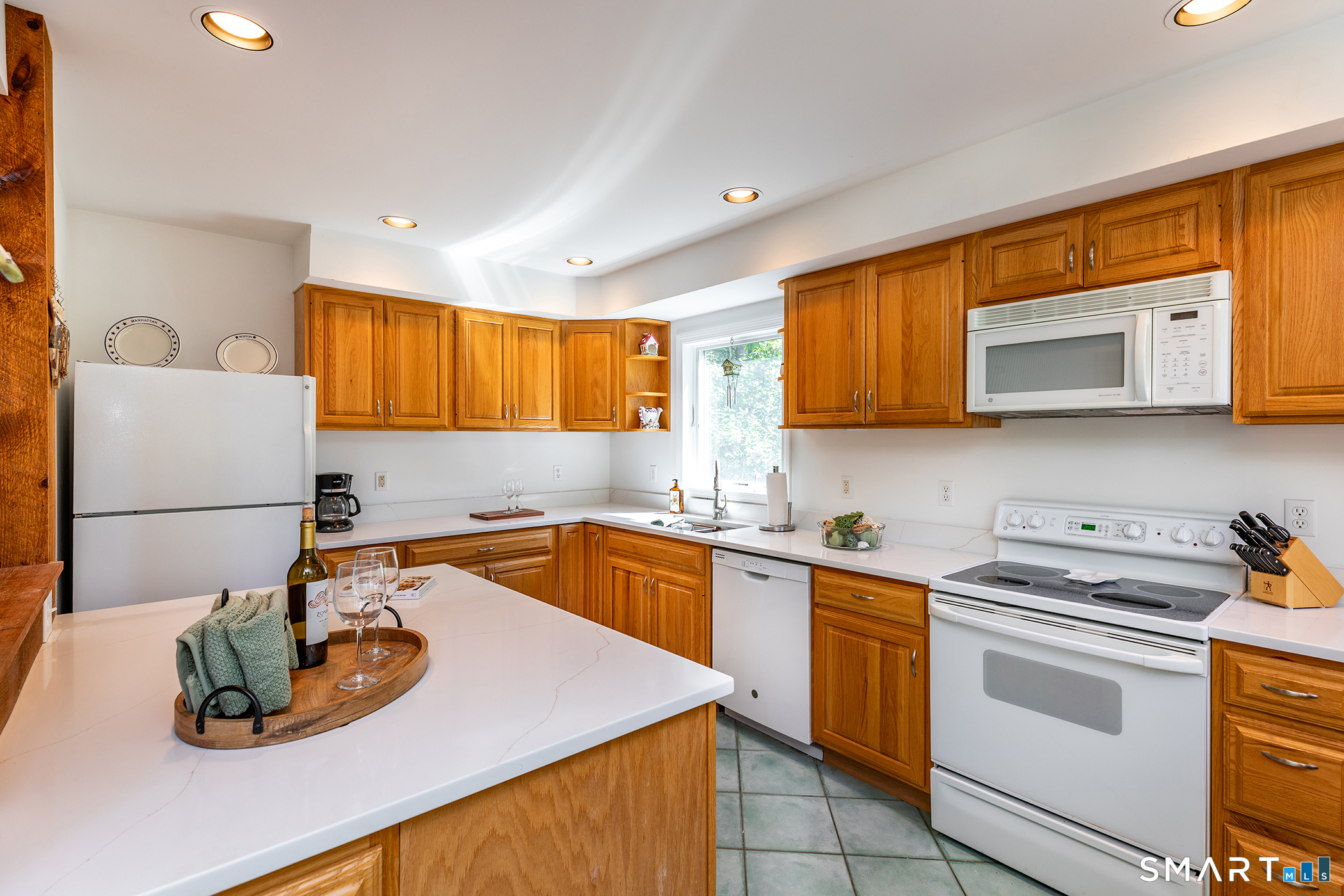 3 Old Forest Road Sherman, CT 06784 - Photo 16 of 38 a kitchen with stainless steel appliances granite countertop a sink stove and microwave