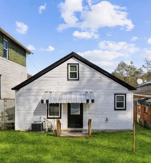 a front view of house with yard